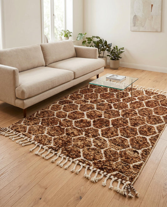 Plush brown and cream geometric Moroccan rug styled in a warm, modern living room with natural wood furniture, by NURA.