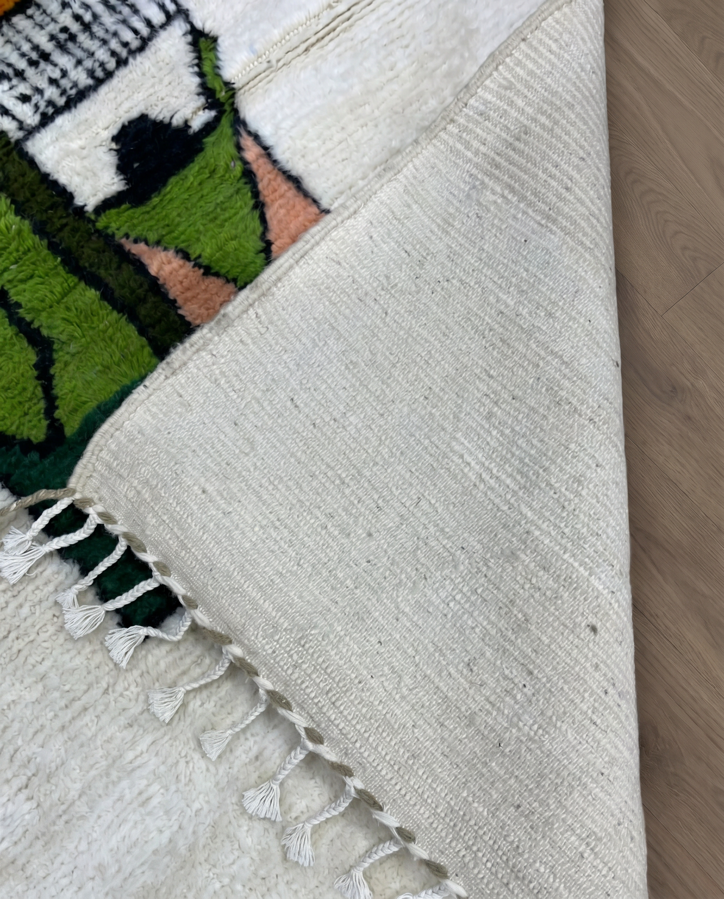 FADWA Azilal ivory abstract figurative motif Moroccan rug back view showing traditional handwoven construction, by NURA