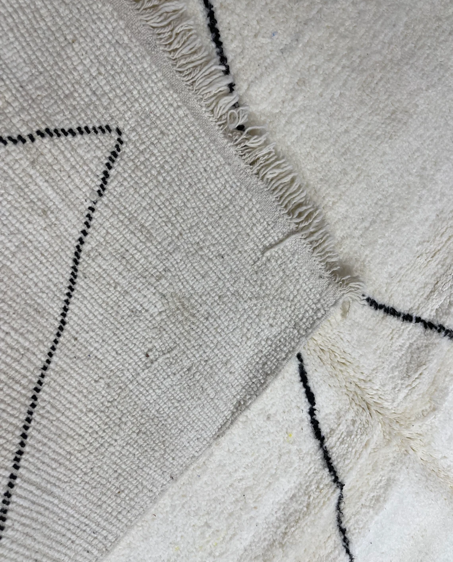 GHITA Beni Ourain ivory diamond lattice Moroccan rug back view showing traditional handwoven construction, by NURA
