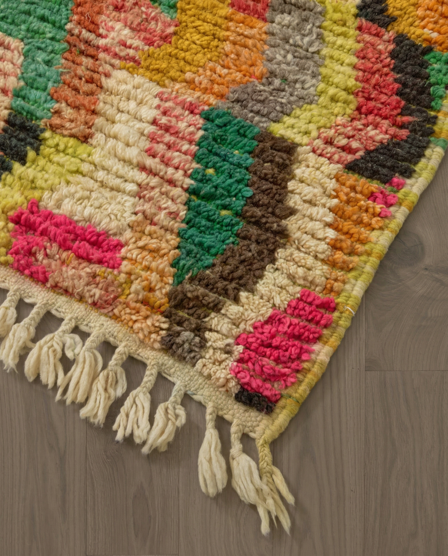 HANAN Azilal hot pink abstract zigzag bands Moroccan rug close-up of hand-tied fringe and kilim band detail, by NURA