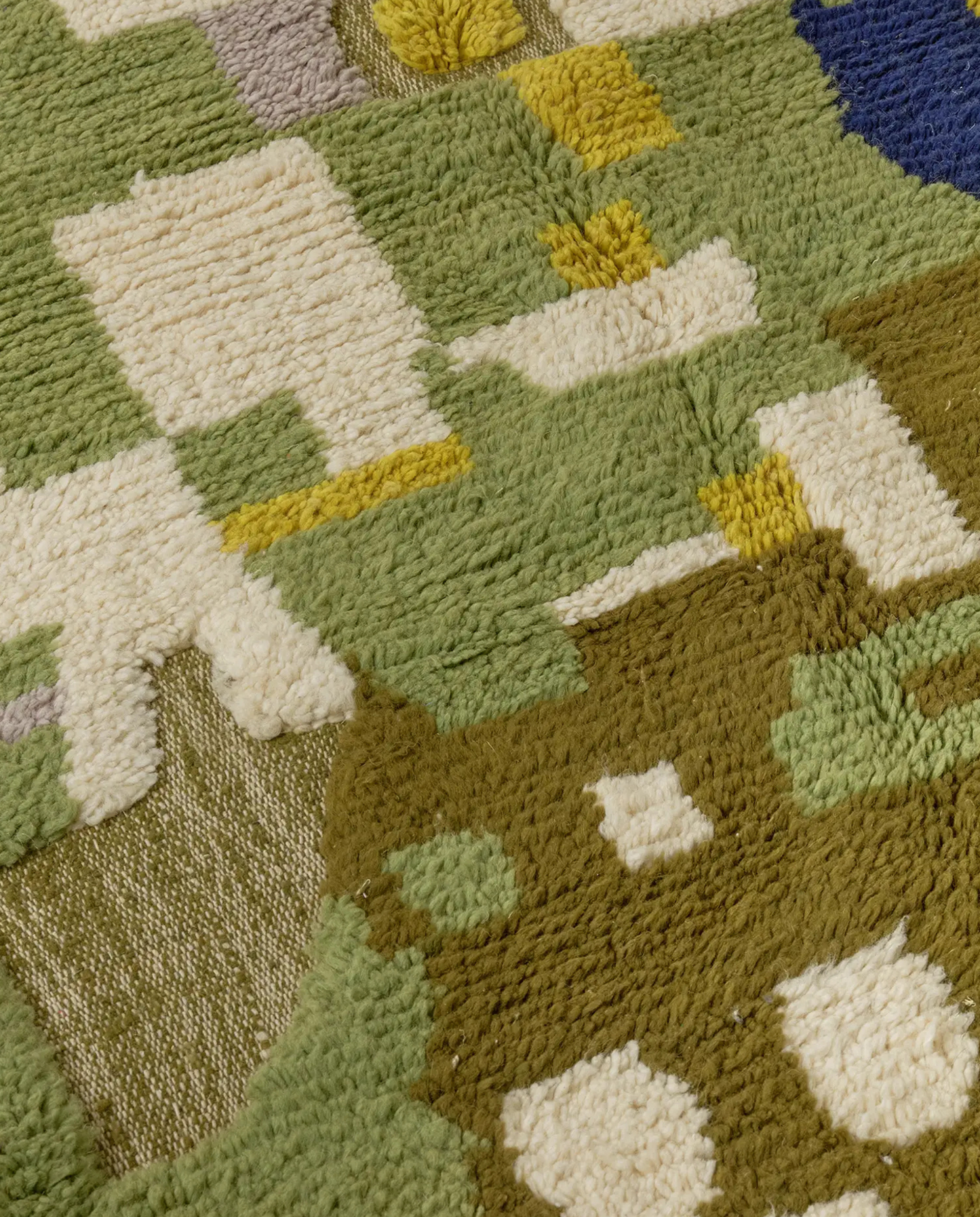 HAYAT Azilal moss green abstract color block Moroccan rug close-up showing hand-knotted wool texture and pile detail 2, by NURA