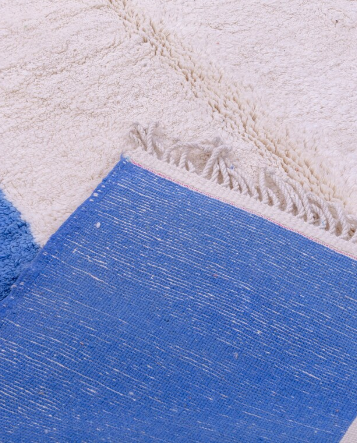 INAS Azilal cream abstract color block Moroccan rug back view showing traditional handwoven construction, by NURA