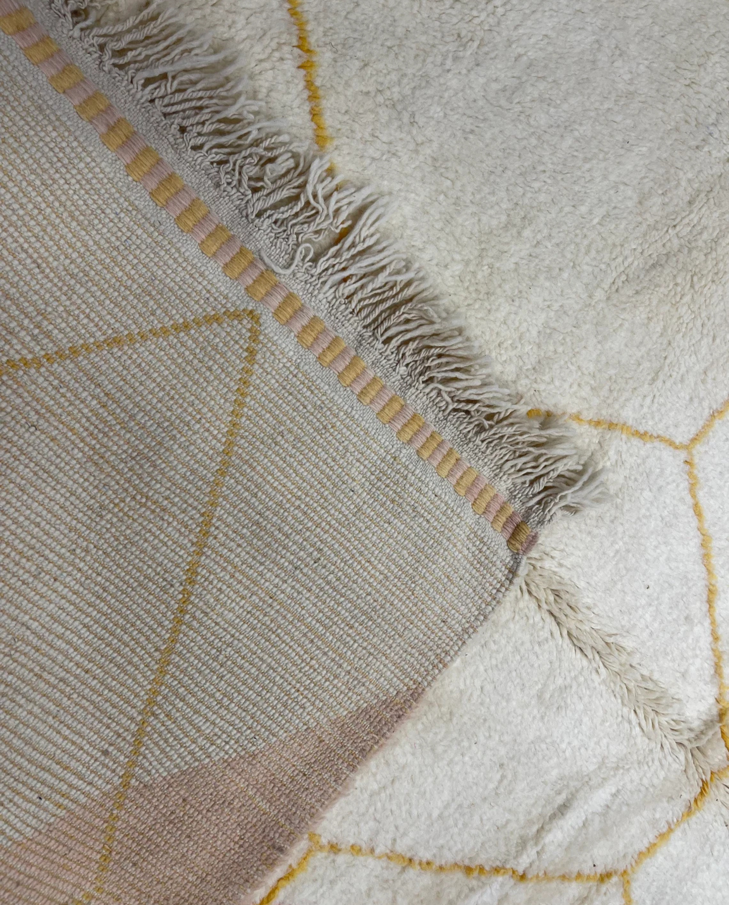 MALAK Beni Ourain cream abstract color block Moroccan rug back view showing traditional handwoven construction, by NURA