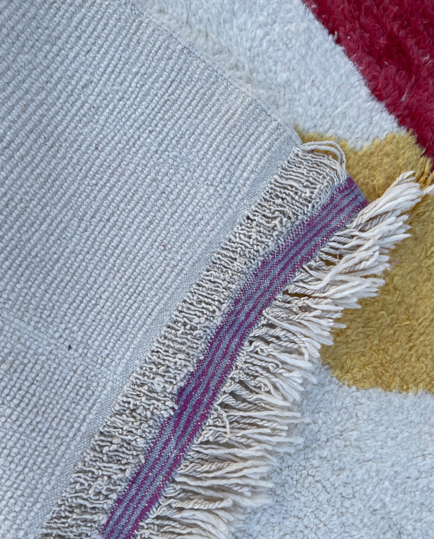 MOUNIRA Azilal ivory abstract color block Moroccan rug back view showing traditional handwoven construction, by NURA