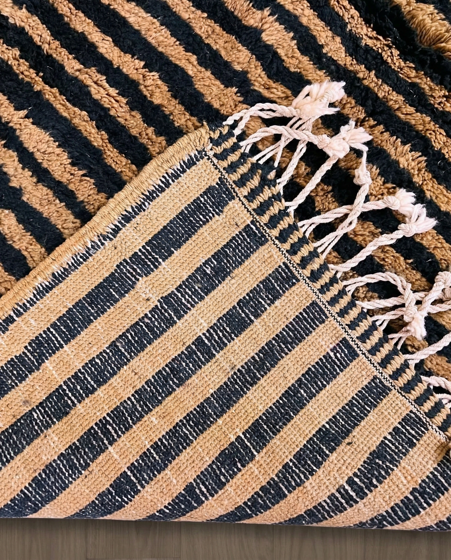 NABILA Beni Ourain black horizontal stripes Moroccan rug back view showing traditional handwoven construction, by NURA