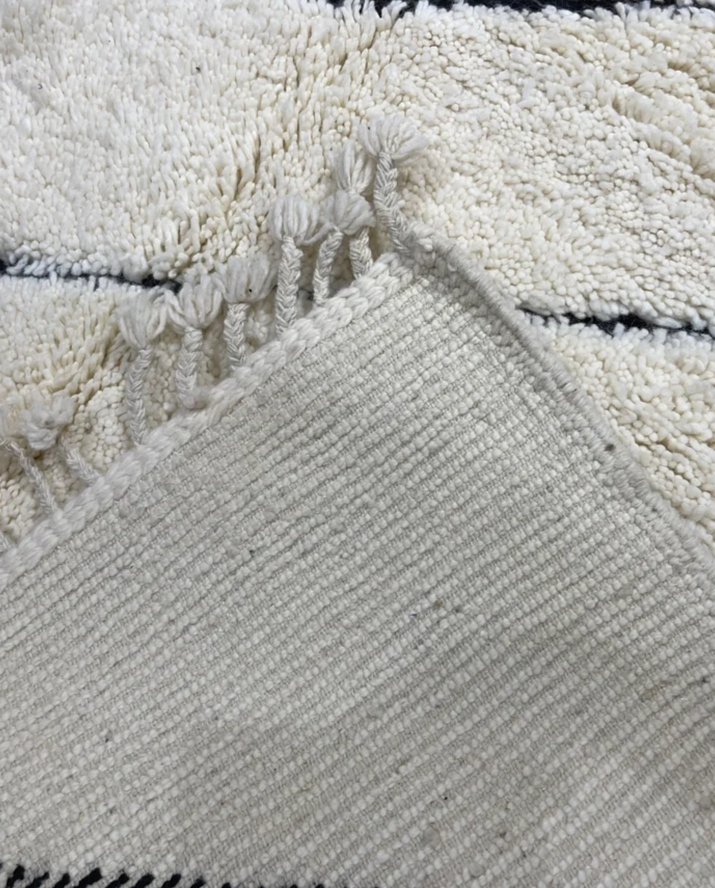 NASSIMA Beni Ourain ivory abstract diamond lattice Moroccan rug back view showing traditional handwoven construction, by NURA