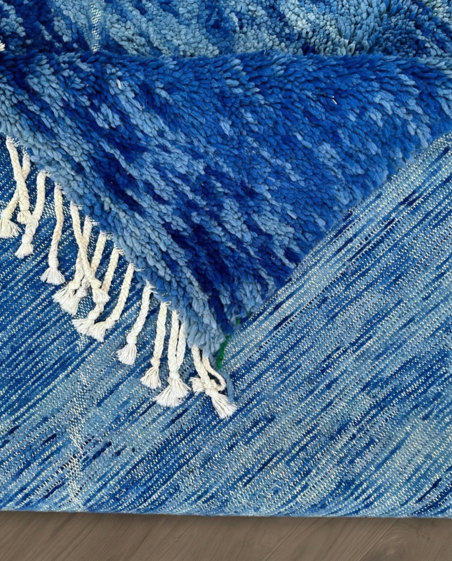 NOUHA Beni Ourain cobalt diamond lattice Moroccan rug back view showing traditional handwoven construction, by NURA