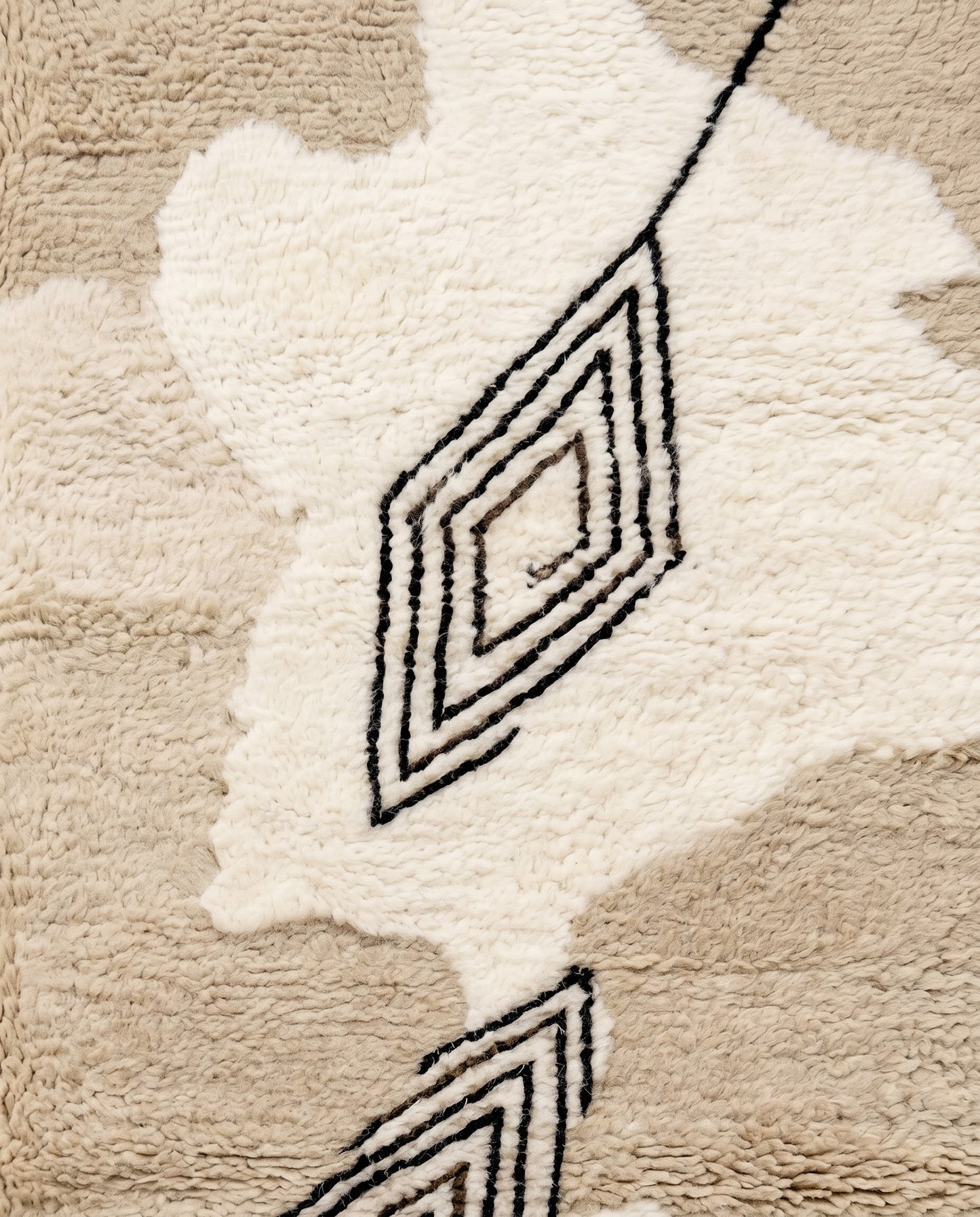 NOURIA Beni Ourain beige floating forms Moroccan rug close-up showing hand-knotted wool texture and pile detail, by NURA