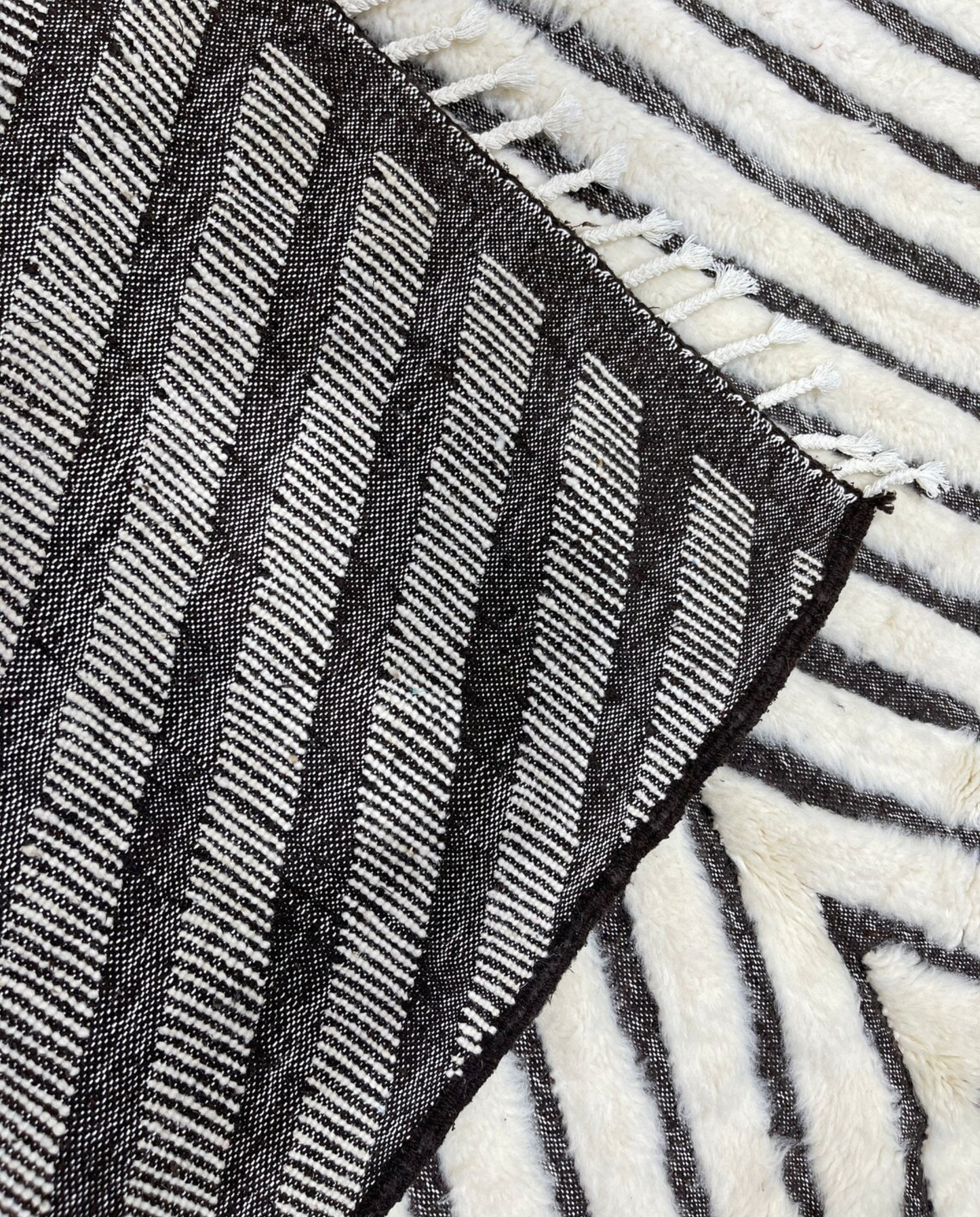 RIM Beni Ourain charcoal concentric diamond Moroccan rug back view showing traditional handwoven construction, by NURA