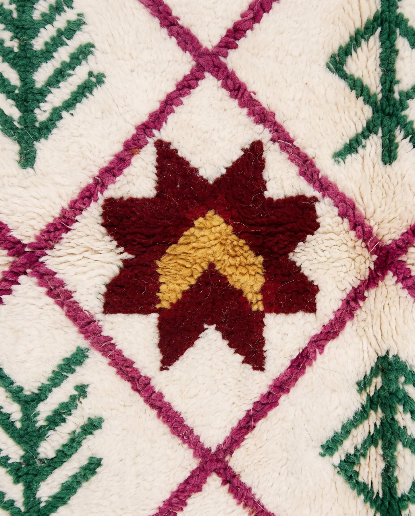 ROUKIA Azilal cream diamond lattice Moroccan rug close-up showing hand-knotted wool texture and pile detail, by NURA
