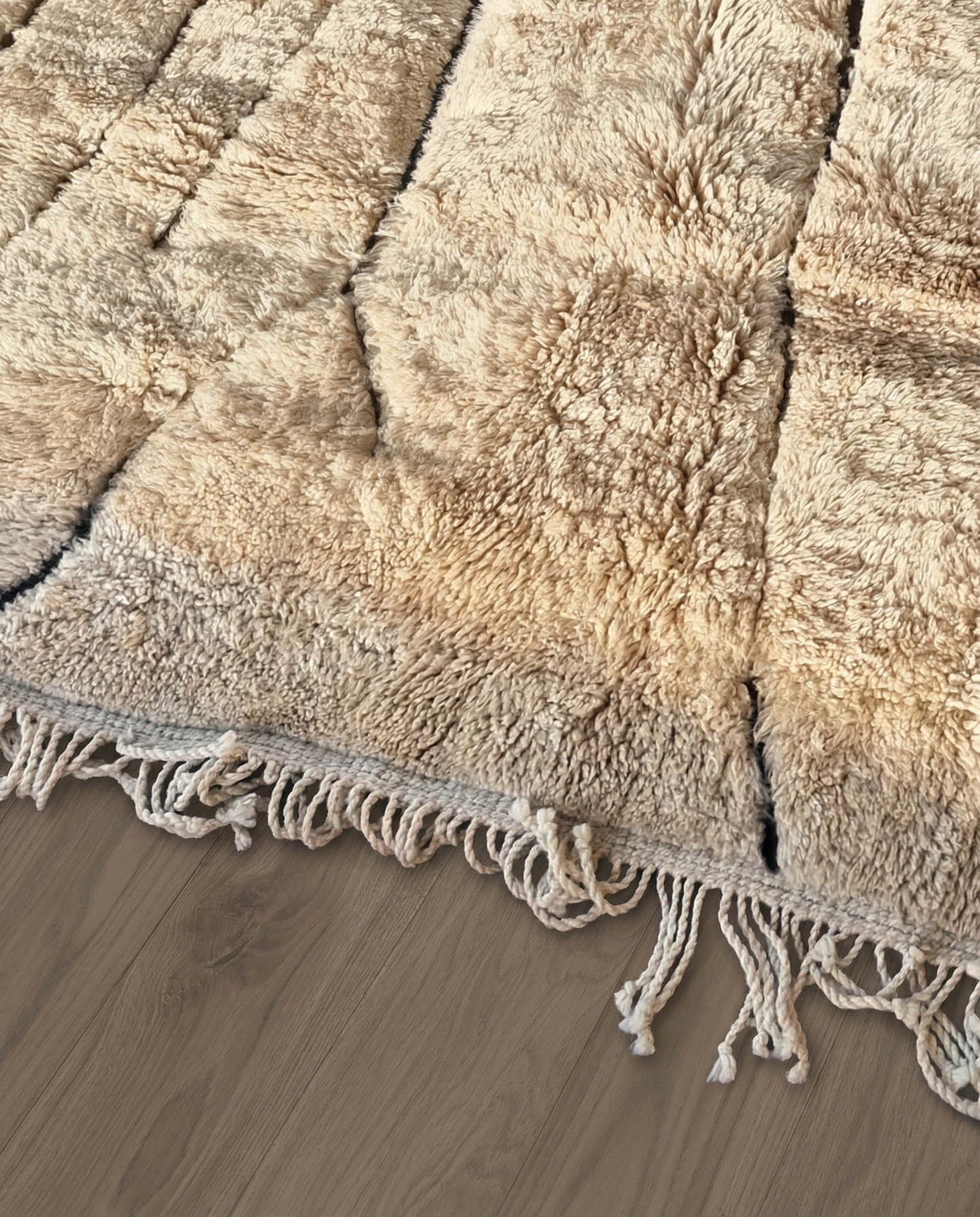 SOFIA Mrirt beige organic abstract Moroccan rug close-up of hand-tied fringe and kilim band detail, by NURA