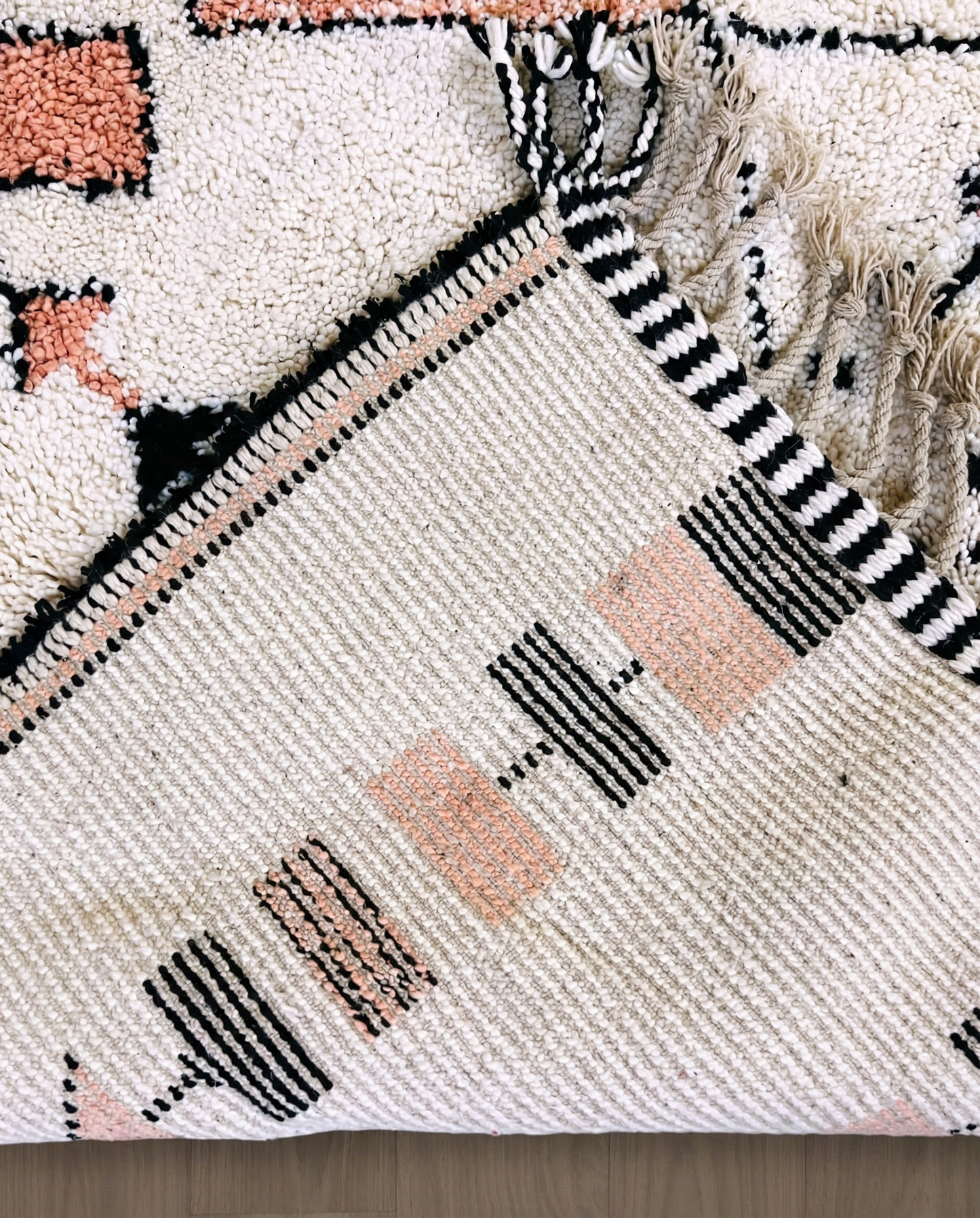 SOUHAILA Azilal cream scattered floating motifs Moroccan rug back view showing traditional handwoven construction, by NURA