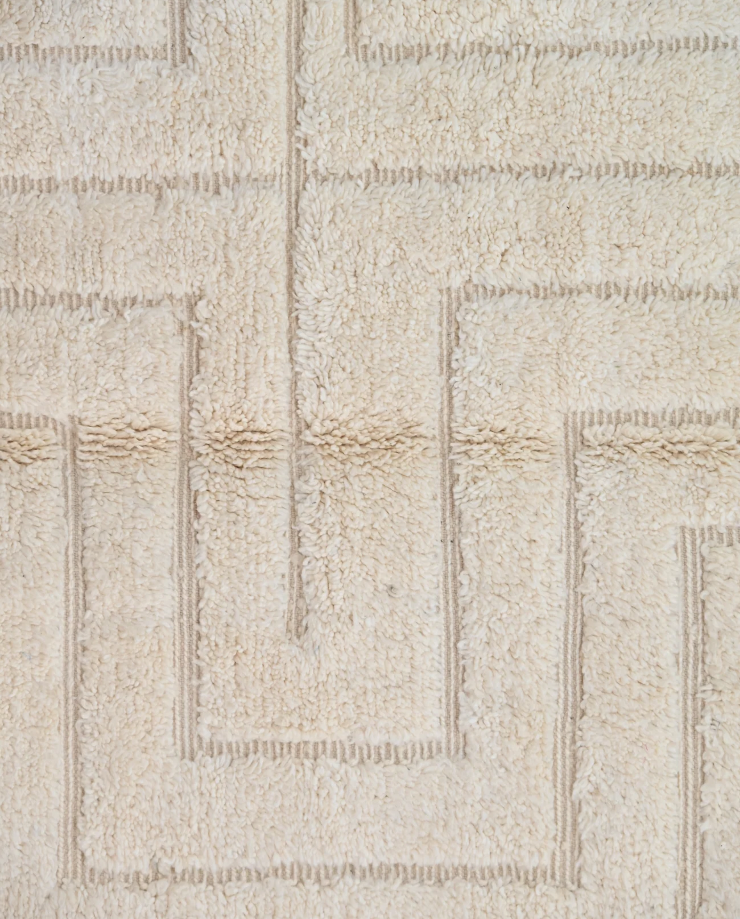ABLA Beni Ourain cream geometric maze Moroccan rug close-up showing hand-knotted wool texture and pile detail 1, by NURA