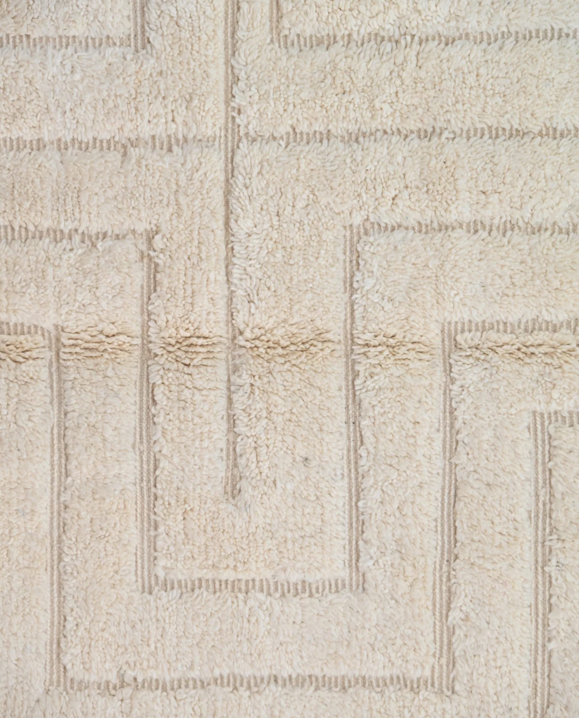 ABLA Beni Ourain cream geometric maze Moroccan rug close-up showing hand-knotted wool texture and pile detail 1, by NURA