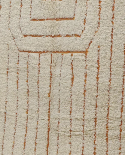 ADILA Beni Ourain cream organic abstract Moroccan rug close-up showing hand-knotted wool texture and pile detail, by NURA