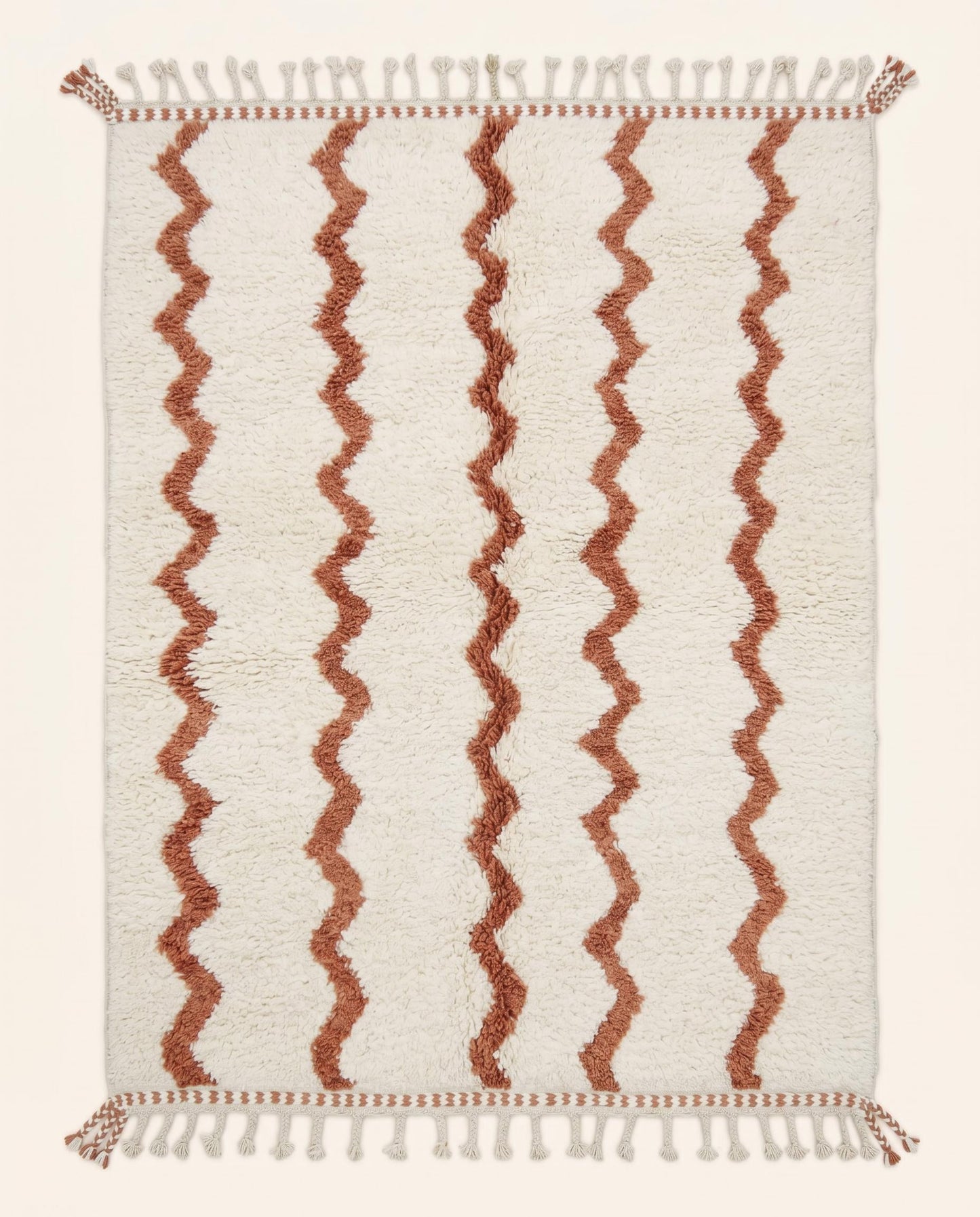 Hand-knotted Beni Ourain Moroccan rug featuring a plush cream wool pile with vertical wavy terracotta lines, by NURA.