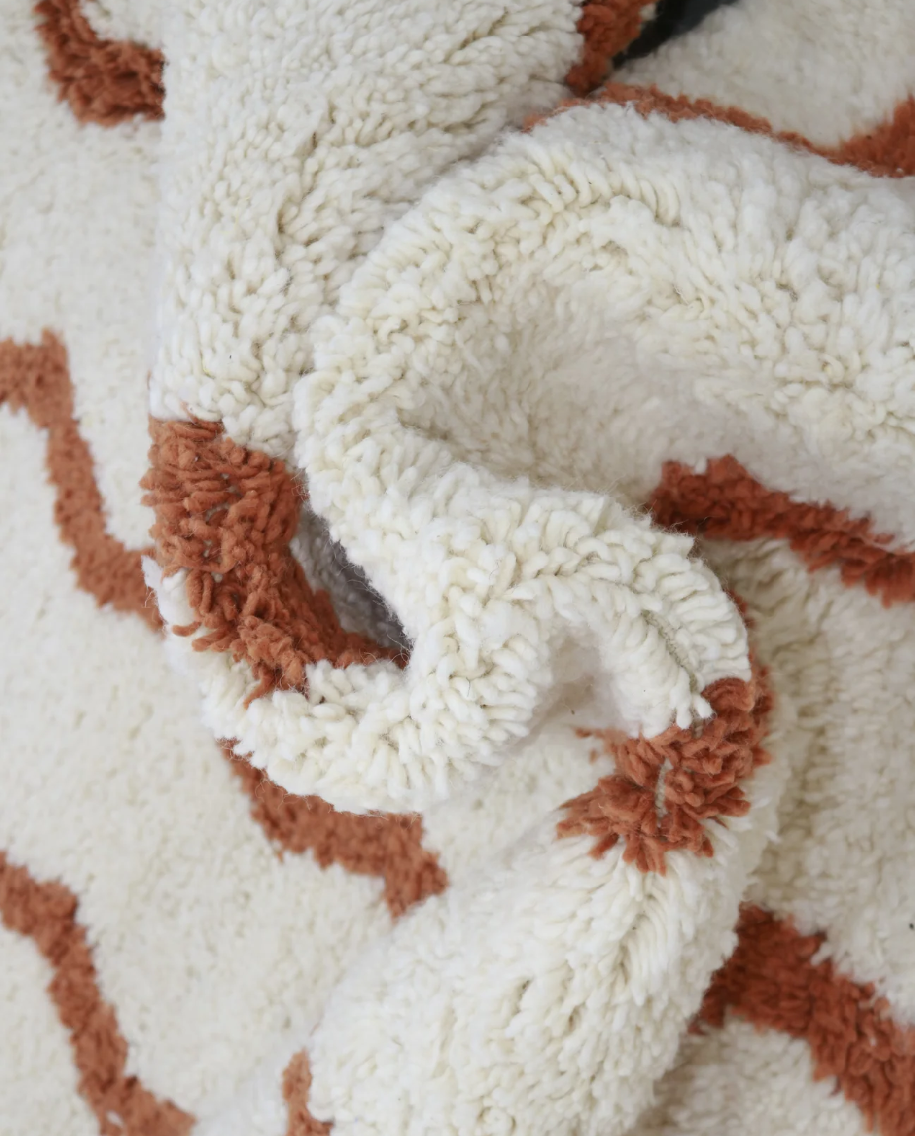 AFARA Beni Ourain cream wavy striped field Moroccan rug close-up showing hand-knotted wool texture and pile detail, by NURA