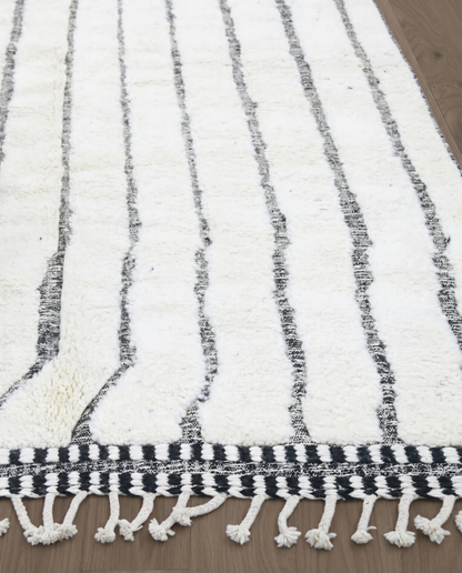 AFRA Beni Ourain cream organic abstract Moroccan rug close-up of hand-tied fringe and kilim band detail 1, by NURA