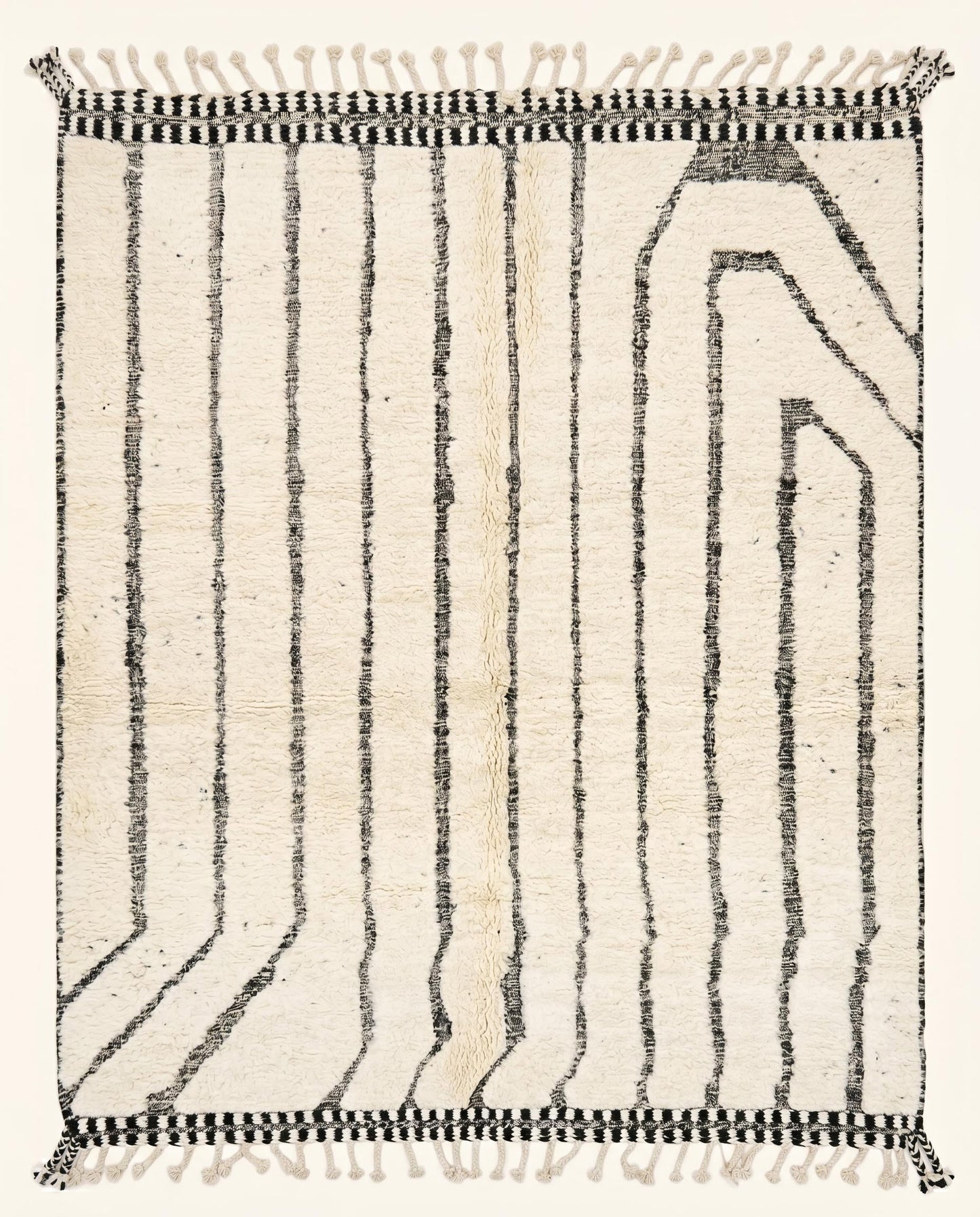 Plush cream Moroccan Beni Ourain rug featuring thin black vertical lines and an asymmetrical geometric arch by NURA.