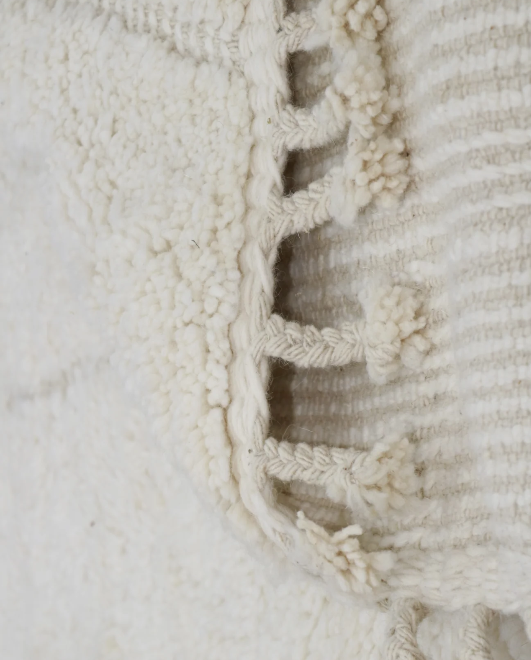 AKILA Beni Ourain cream organic abstract Moroccan rug back view showing traditional handwoven construction, by NURA
