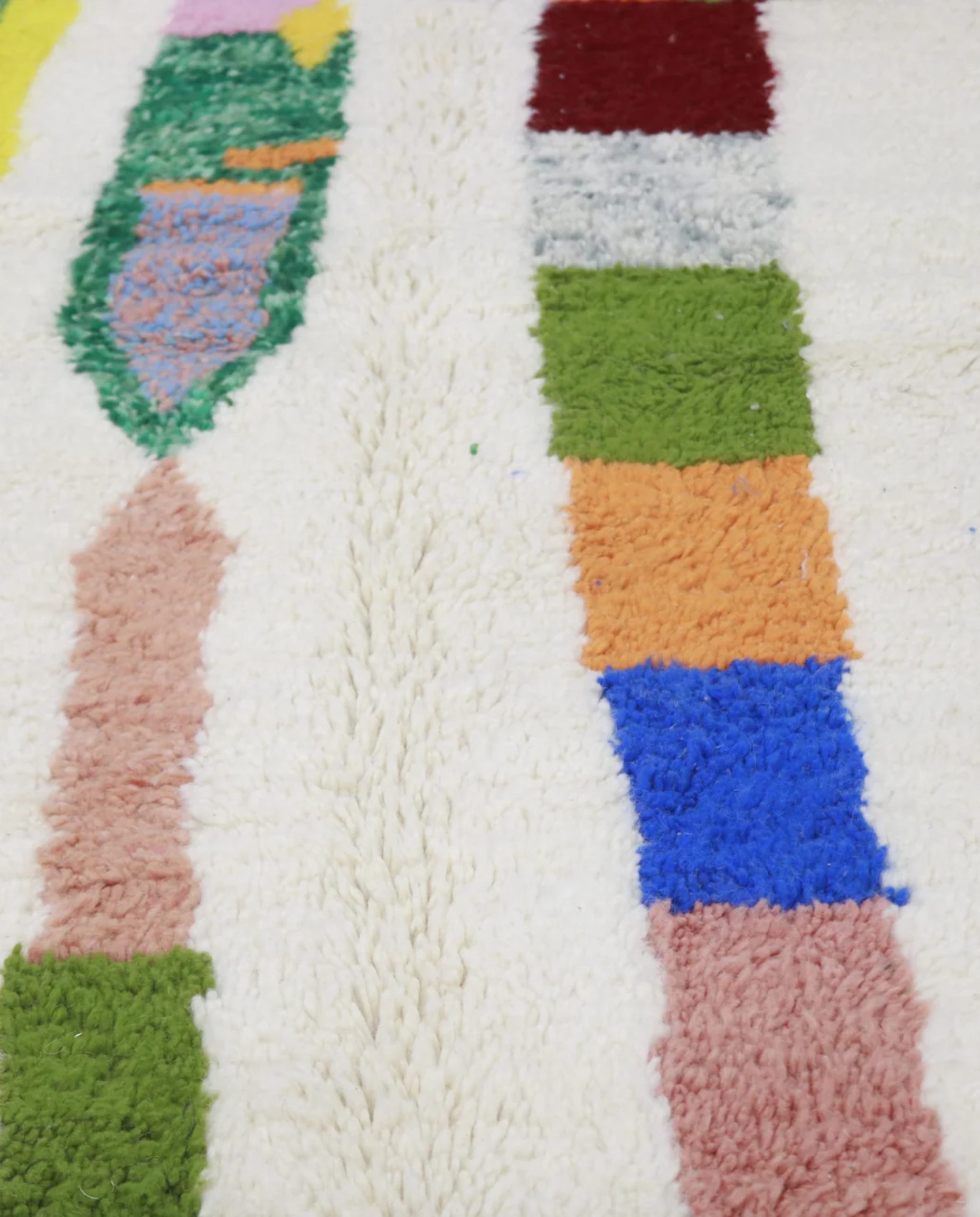 ALIMA Azilal cream organic abstract Moroccan rug close-up showing hand-knotted wool texture and pile detail, by NURA