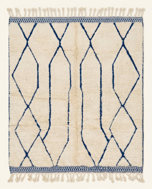 Plush cream Beni Ourain Moroccan rug with a large-scale cobalt blue diamond lattice and thick high pile, by NURA.