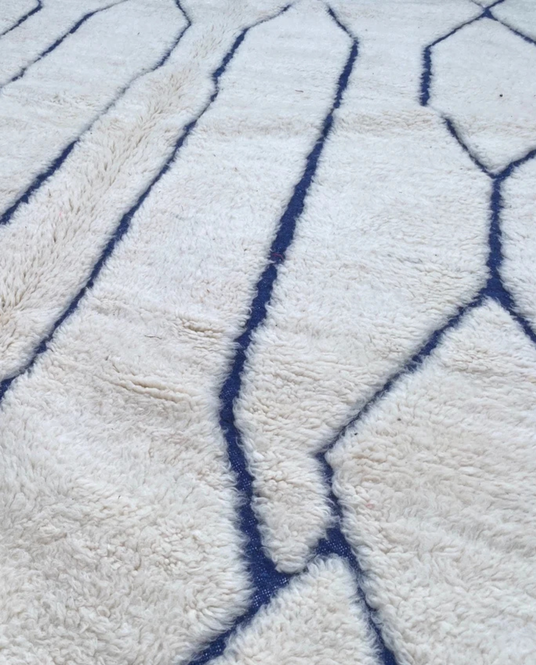 AMAL Beni Ourain cream diamond lattice Moroccan rug close-up showing hand-knotted wool texture and pile detail 2, by NURA