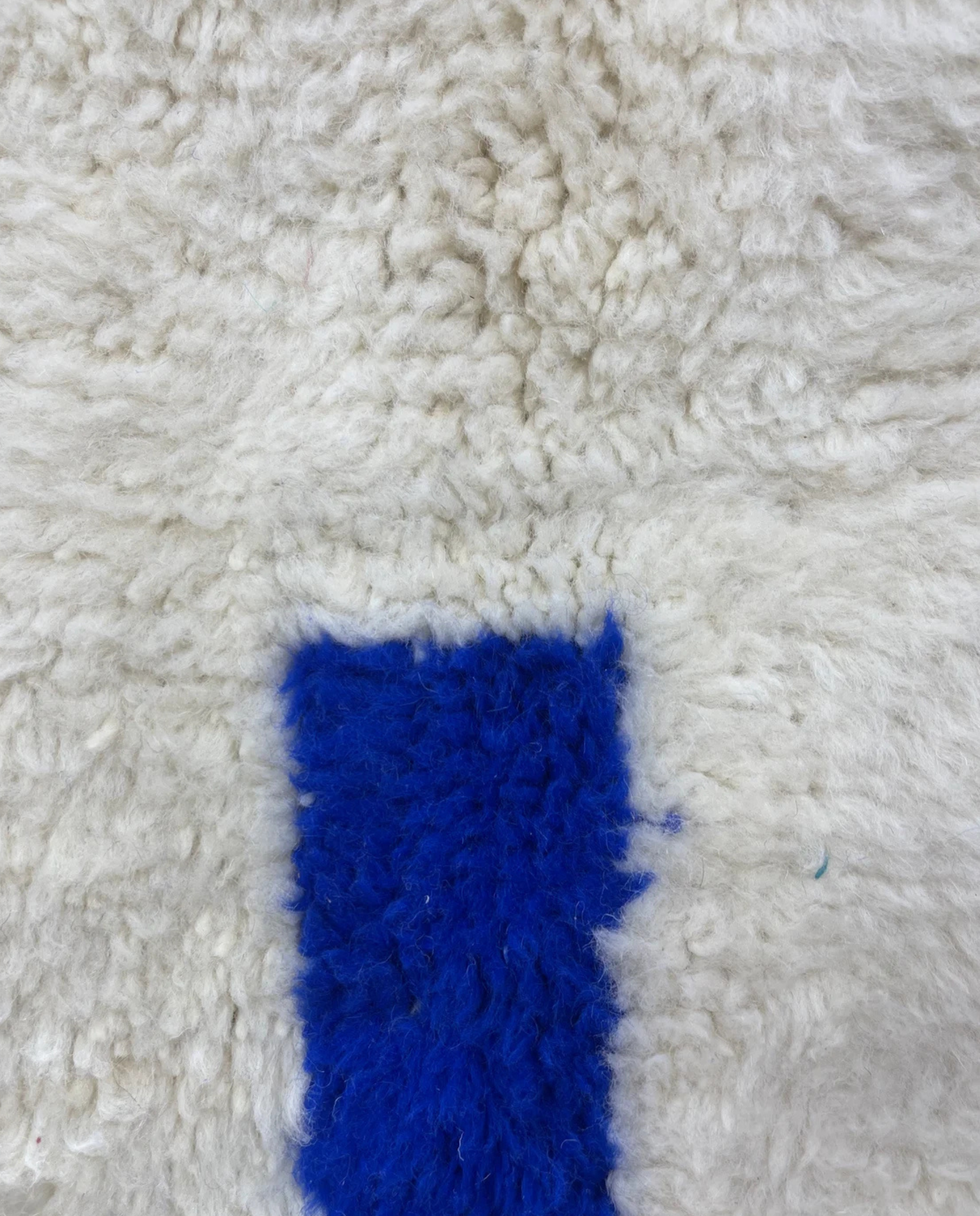 AMANI Beni Ourain ivory bold striped field Moroccan rug close-up showing hand-knotted wool texture and pile detail, by NURA