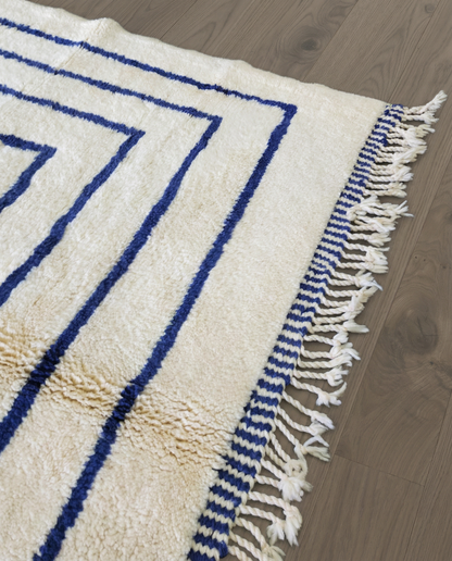 AMINA Beni Ourain cream nested border medallion Moroccan rug close-up of hand-tied fringe and kilim band detail 2, by NURA