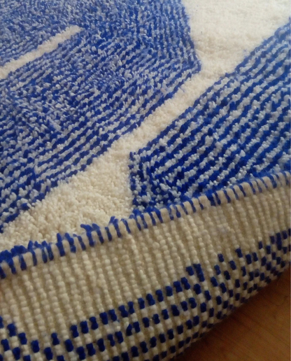 AMIRA Beni Ourain cobalt oversized geometric motif Moroccan rug back view showing traditional handwoven construction, by NURA