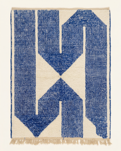 Plush ivory and cobalt blue Beni Ourain Moroccan rug with an oversized geometric motif and thick striped borders, by NURA.