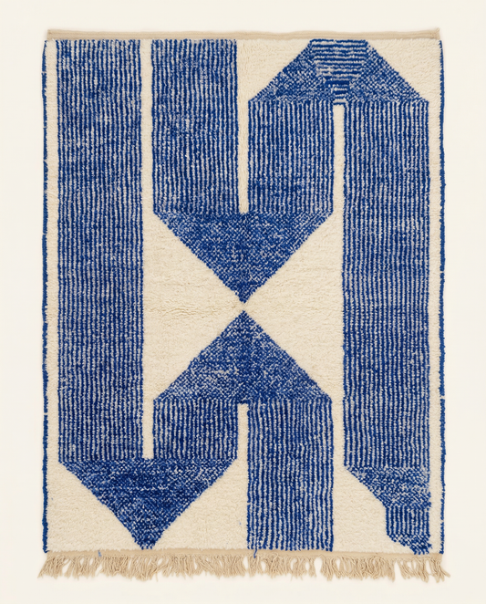 Plush ivory and cobalt blue Beni Ourain Moroccan rug with an oversized geometric motif and thick striped borders, by NURA.