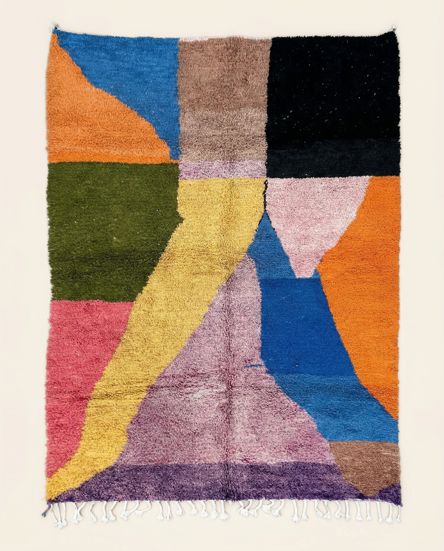 Plush multicolor Moroccan rug with bold abstract color blocks in cobalt, mustard, and pink, featuring a thick high pile, by NURA.