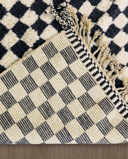 ANISSA Beni Ourain black checkerboard grid Moroccan rug back view showing traditional handwoven construction, by NURA