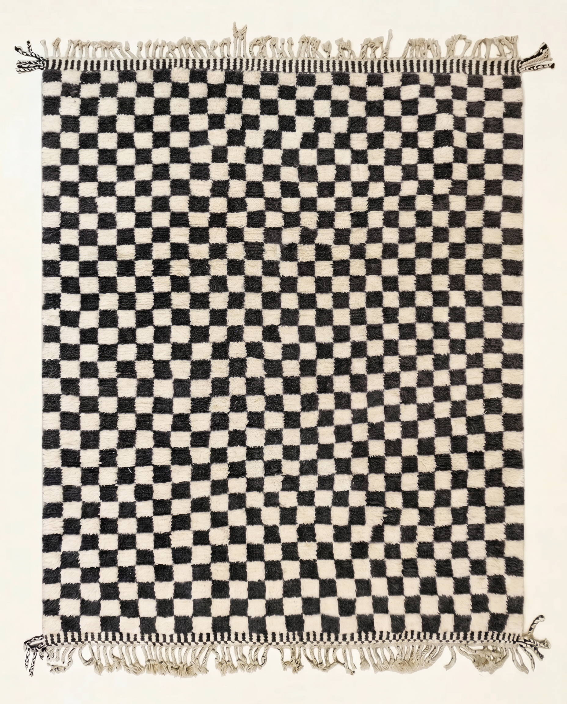 Plush black and cream Beni Ourain Moroccan rug with a bold checkerboard grid and high pile, by NURA.