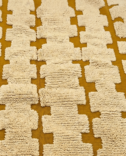 ARWA Beni Ourain mustard stepped columns Moroccan rug close-up showing hand-knotted wool texture and pile detail, by NURA