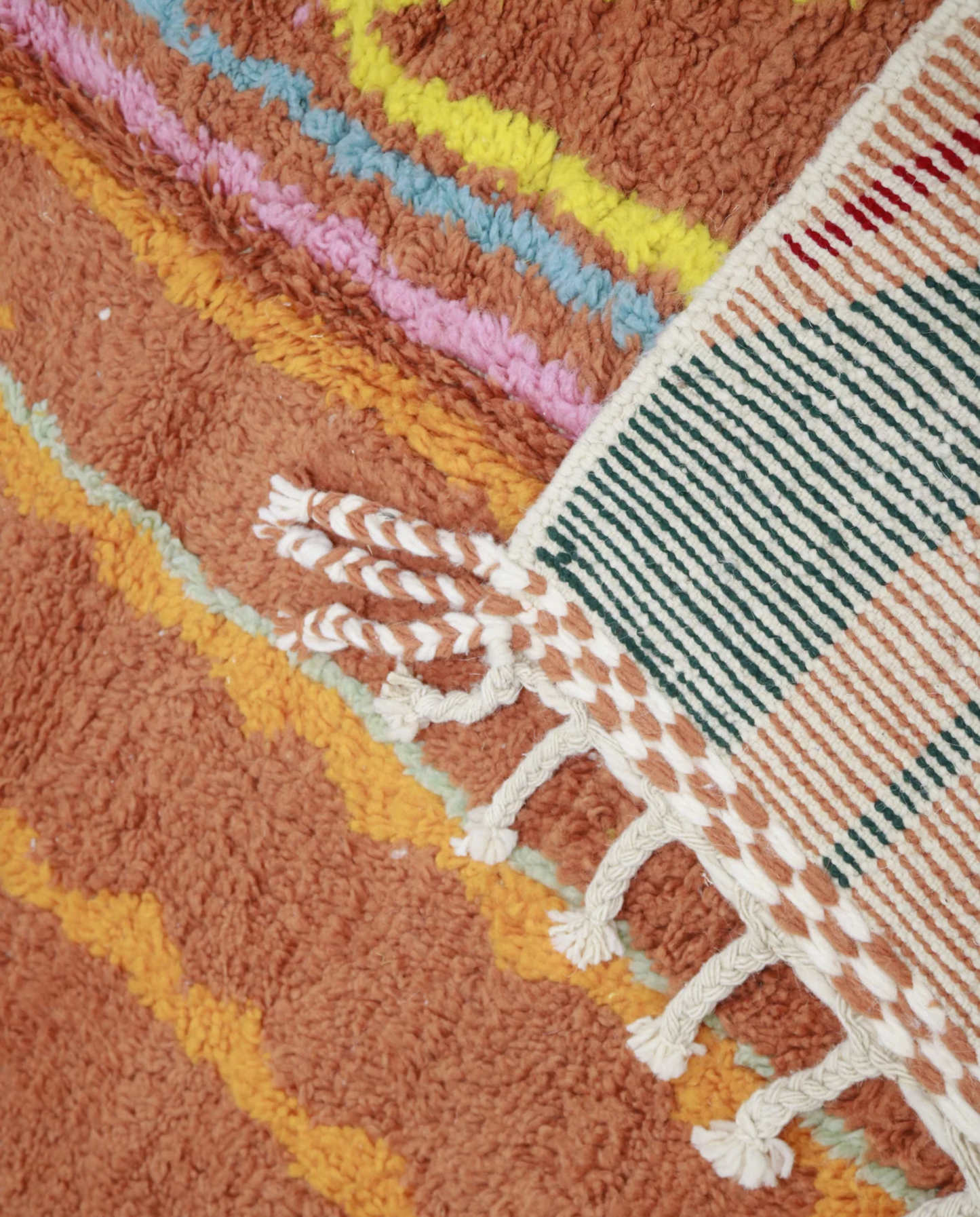 ASALA Boujad terracotta organic abstract Moroccan rug close-up of hand-tied fringe and kilim band detail 1, by NURA