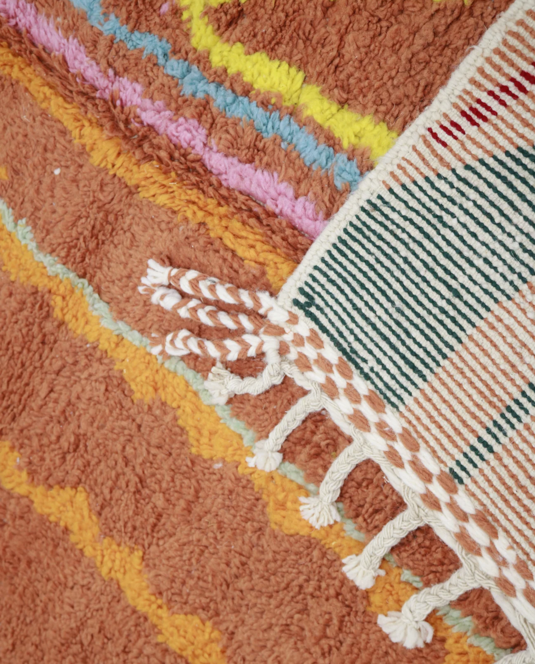 ASALA Boujad terracotta organic abstract Moroccan rug close-up of hand-tied fringe and kilim band detail 1, by NURA