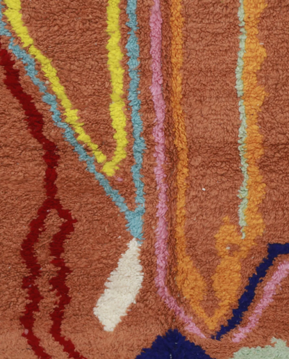ASALA Boujad terracotta organic abstract Moroccan rug close-up showing hand-knotted wool texture and pile detail, by NURA