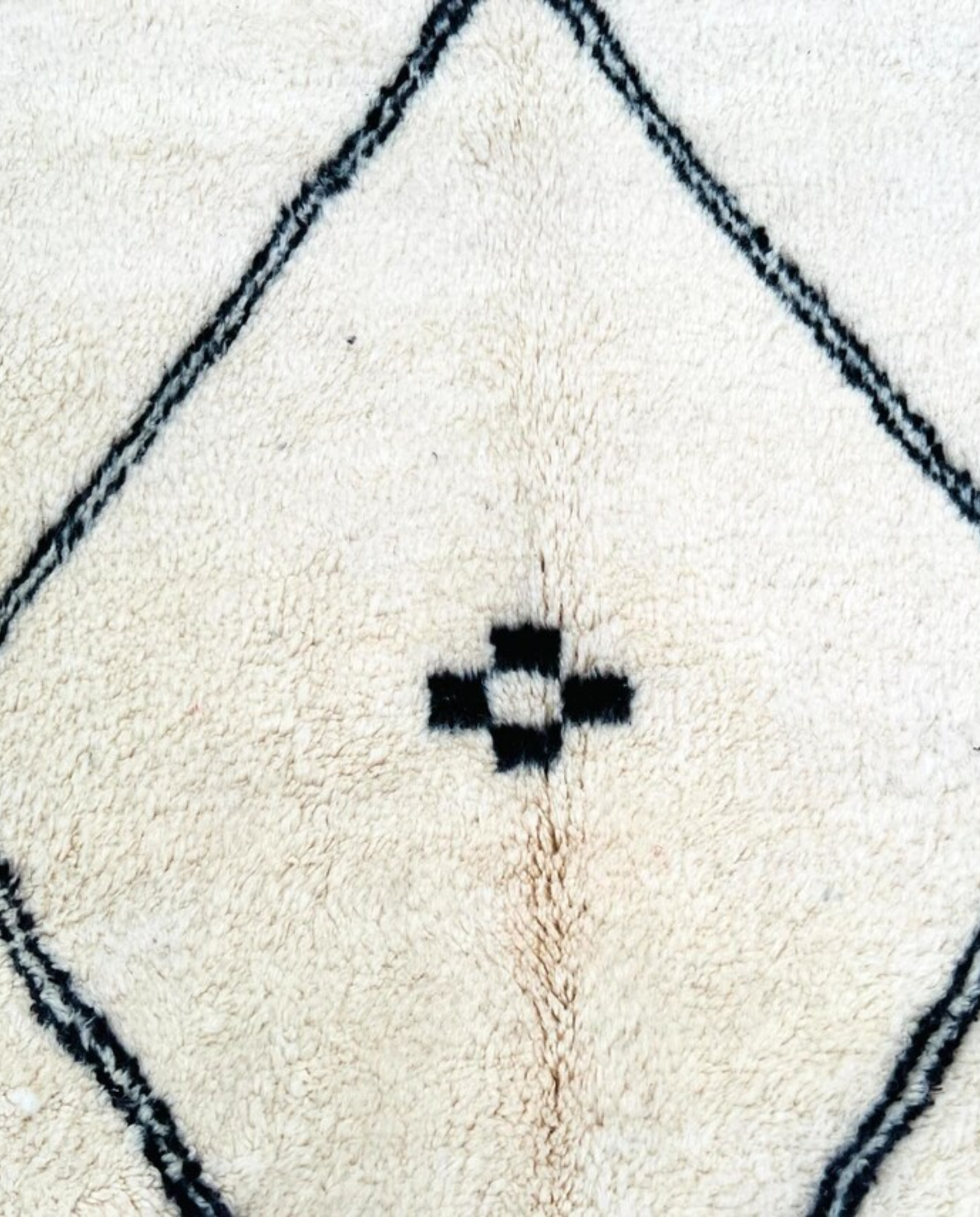 ASMA Beni Ourain cream central double diamond Moroccan rug close-up showing hand-knotted wool texture and pile detail 1, by NURA