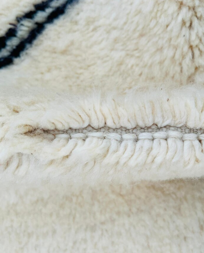 ASMA Beni Ourain cream central double diamond Moroccan rug close-up showing hand-knotted wool texture and pile detail 2, by NURA
