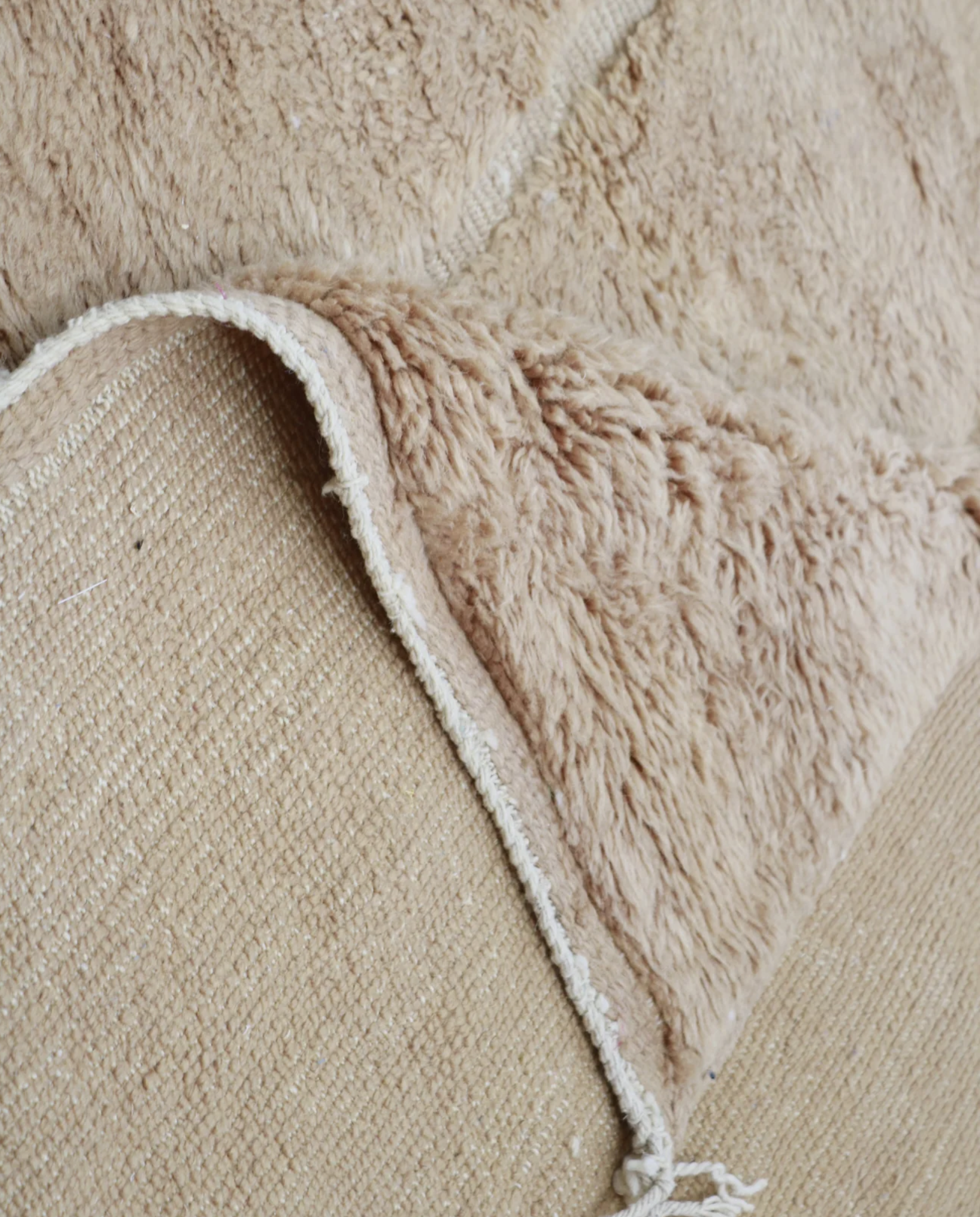 ASSIA Mrirt camel solid carved field Moroccan rug back view showing traditional handwoven construction 1, by NURA
