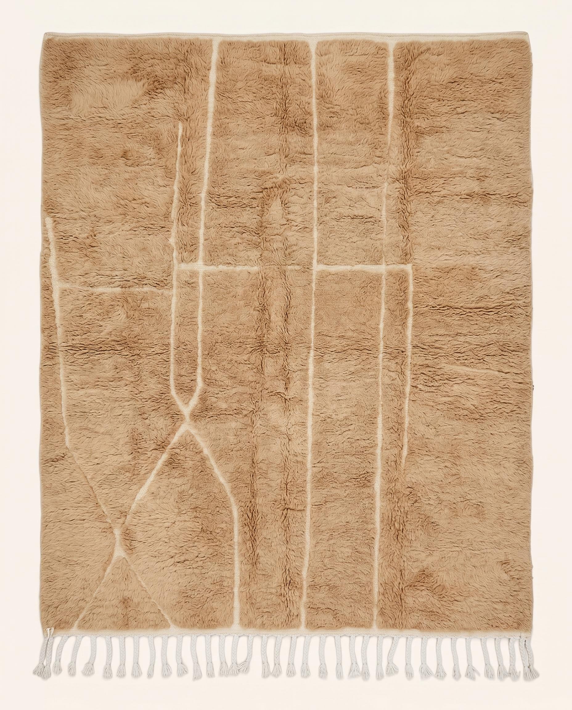 Plush camel Mrirt Moroccan rug featuring a solid field with subtle carved geometric lines, hand-knotted in soft wool by NURA.