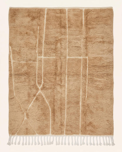 Plush camel Mrirt Moroccan rug featuring a solid field with subtle carved geometric lines, hand-knotted in soft wool by NURA.