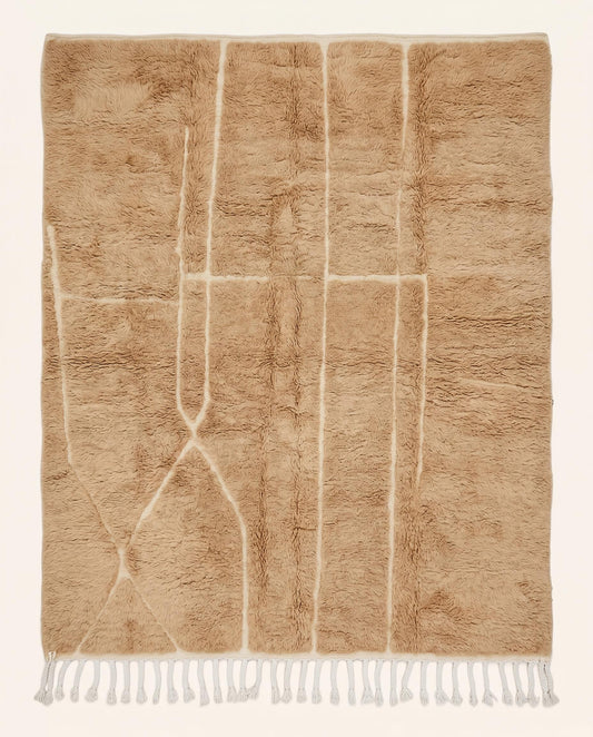 Plush camel Mrirt Moroccan rug featuring a solid field with subtle carved geometric lines, hand-knotted in soft wool by NURA.