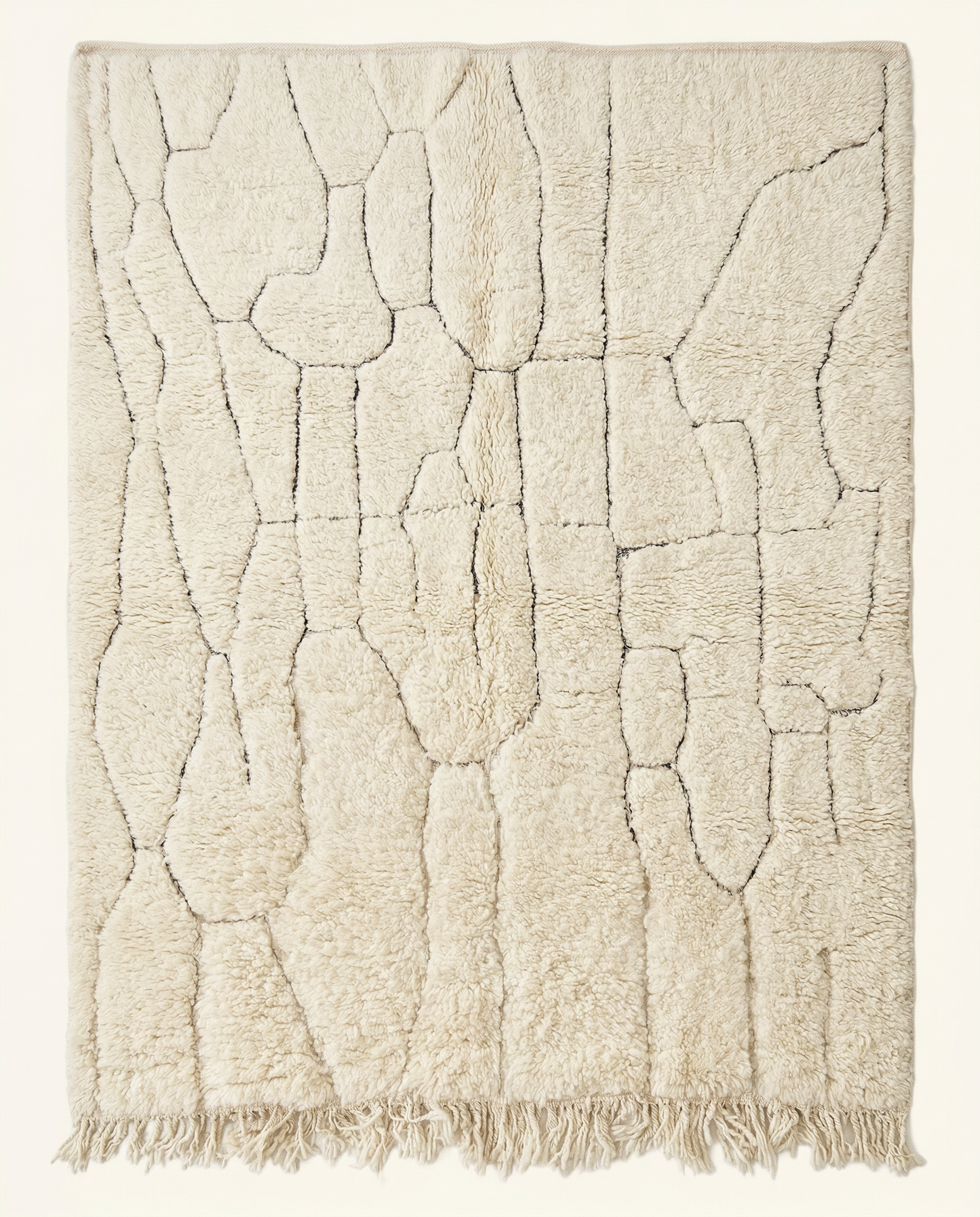 Plush cream Beni Ourain Moroccan rug with a subtle carved linear grid and high pile, by NURA.