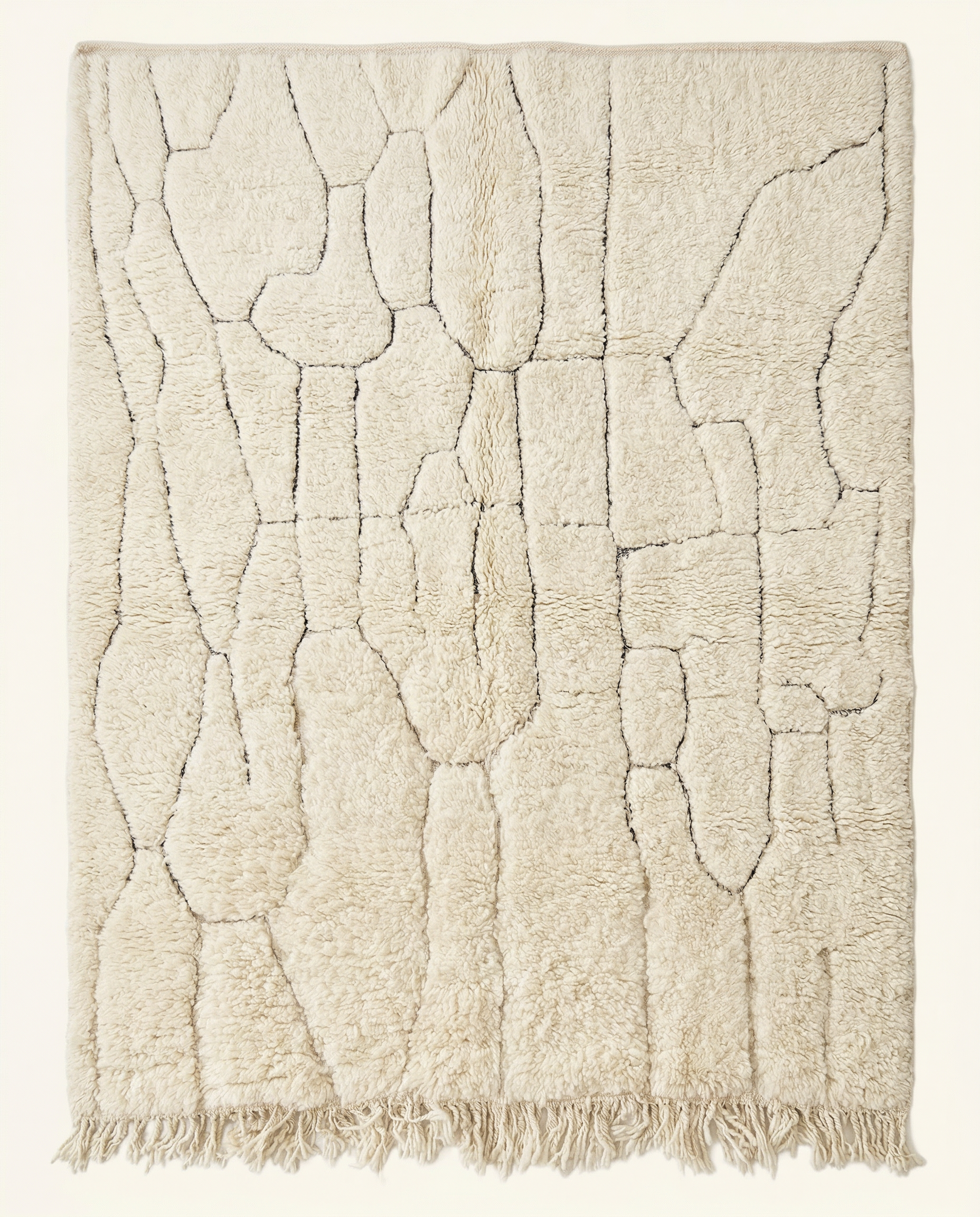 Plush cream Beni Ourain Moroccan rug with a subtle carved linear grid and high pile, by NURA.