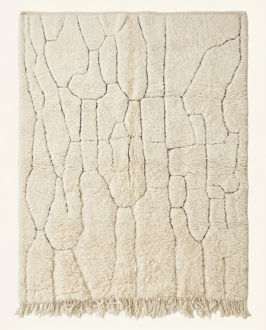 Plush cream Beni Ourain Moroccan rug with a subtle carved linear grid and high pile, by NURA.