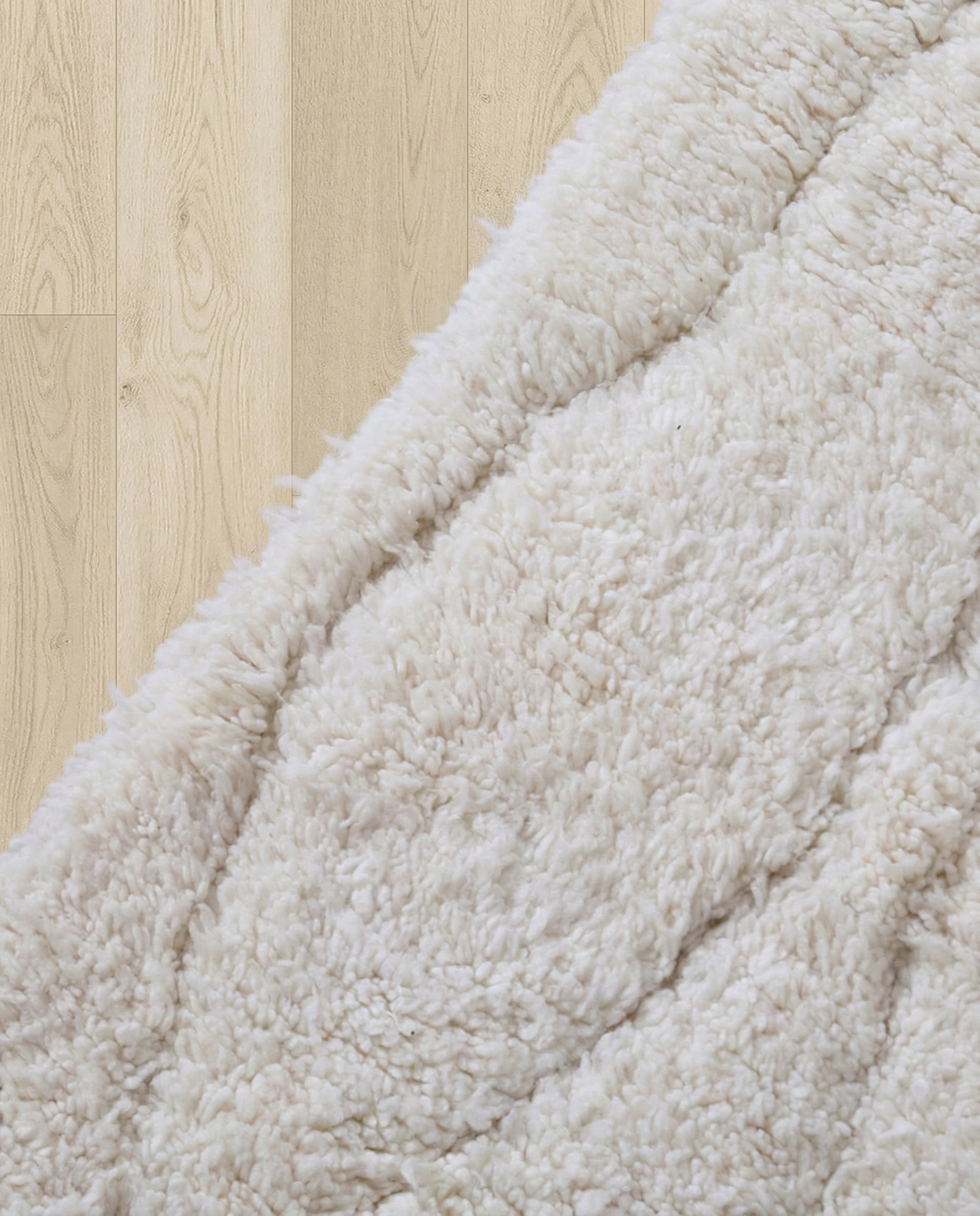 AYA Beni Ourain cream carved linear grid Moroccan rug close-up showing hand-knotted wool texture and pile detail 1, by NURA