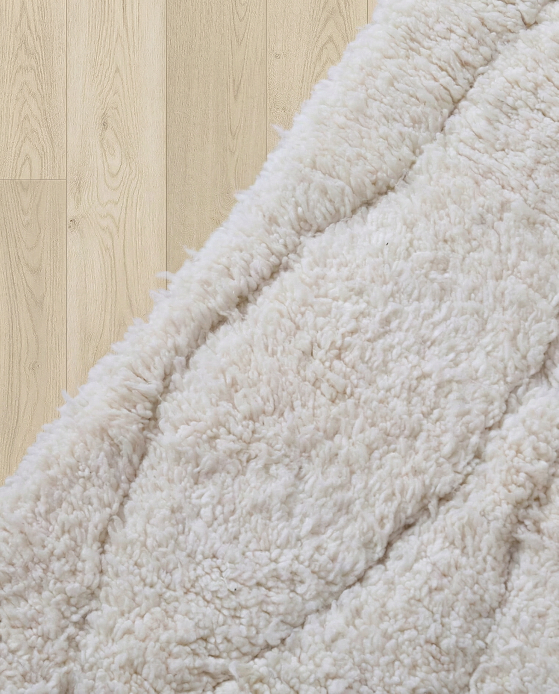 AYA Beni Ourain cream carved linear grid Moroccan rug close-up showing hand-knotted wool texture and pile detail 1, by NURA